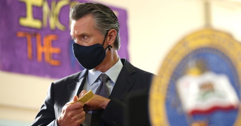 California Gov. Gavin Newsom looks on before speaking at a news conference after meeting with students at James Denman Middle School on Friday in San Francisco.