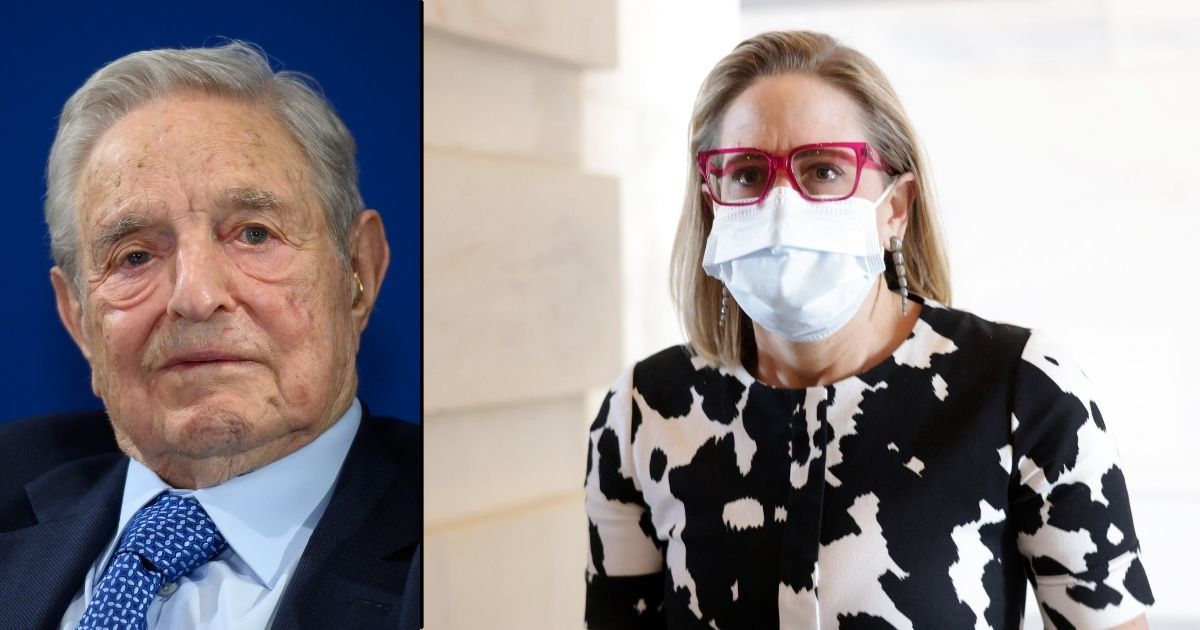 George Soros looks on after having delivered a speech at the World Economic Forum's annual meeting on Jan. 23, 2020, in Davos, Switzerland. Sen. Kyrsten Sinema of Arizona arrives at the U.S. Capitol for a vote on Wednesday in Washington, D.C.