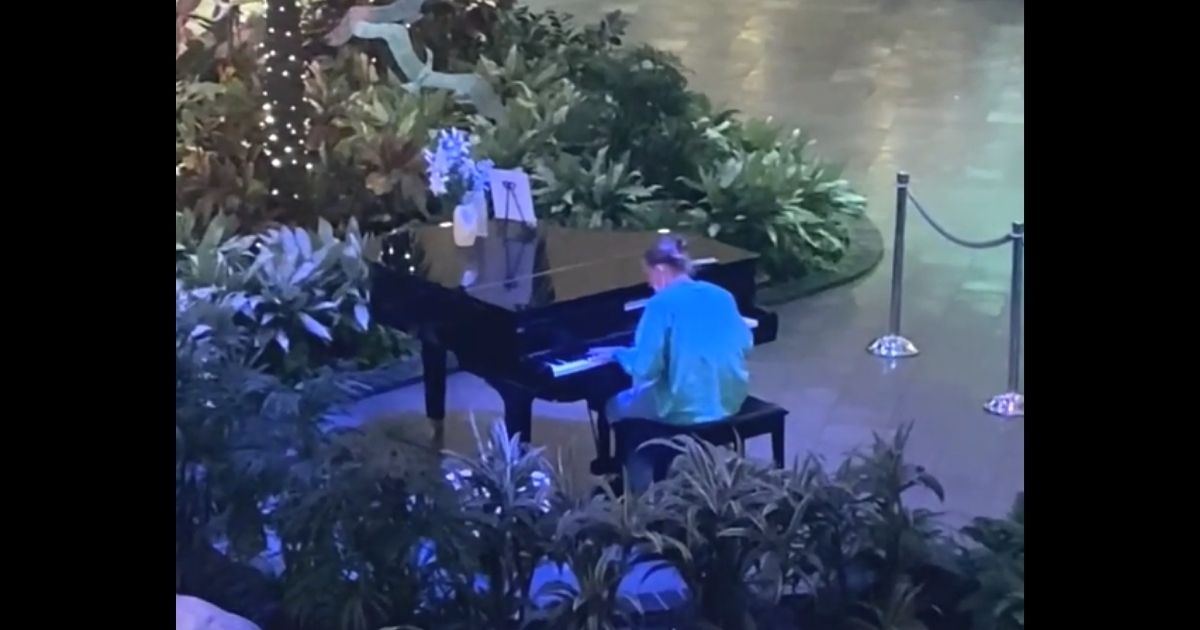 Shawn Foley, a health care worker in Fort Myers, Florida, plays the piano in the lobby of HealthPark Medical Center.