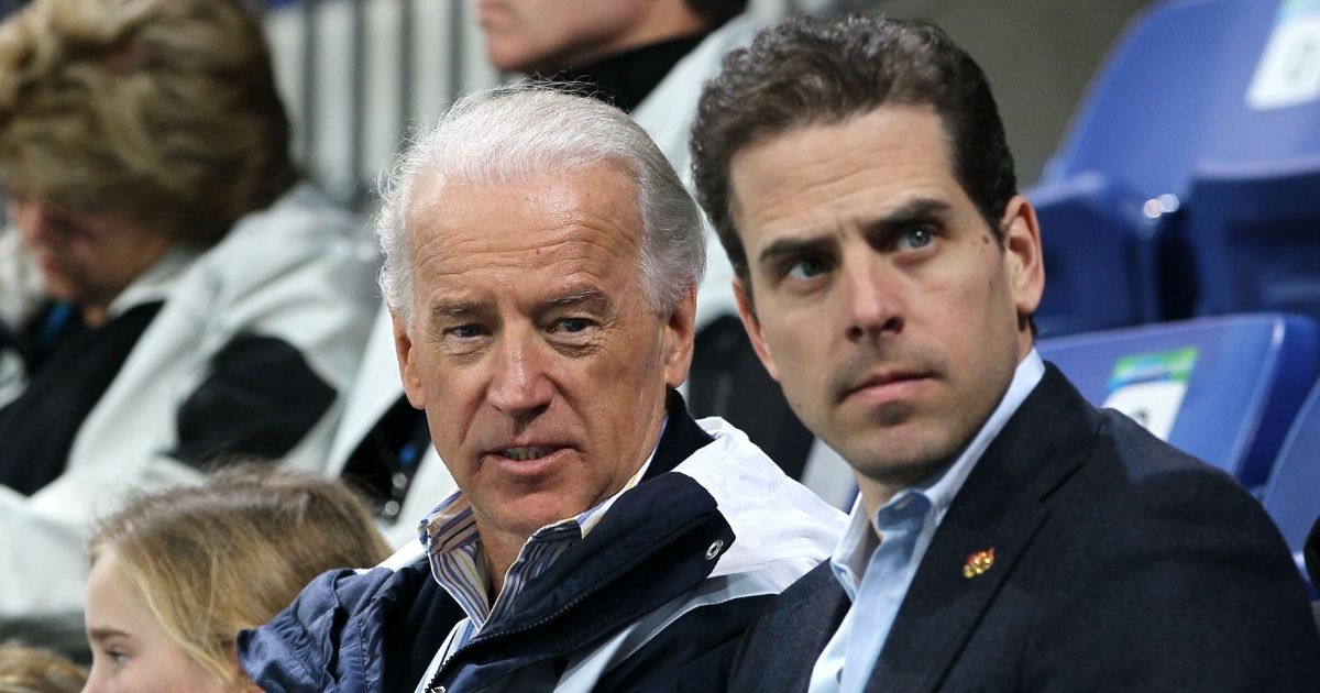Then-Vice President Joe Biden and his son Hunter Biden attend a women's ice hockey preliminary game between United States and China at UBC Thunderbird Arena on Feb. 14, 2010, in Vancouver, Canada.