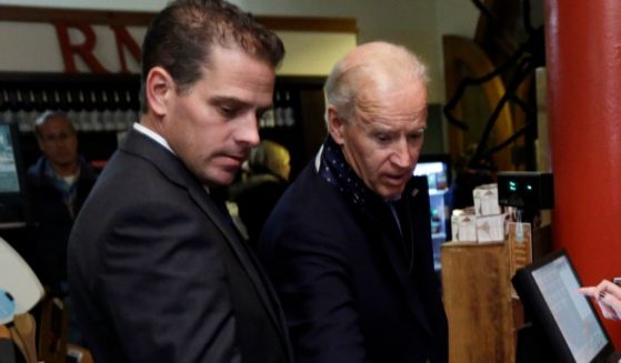 Then-Vice President Joe Biden, right, is accompanied by his son Hunter Biden during a visit to the Red Mug on Nov. 2, 2012, in Superior, Wisconsin.