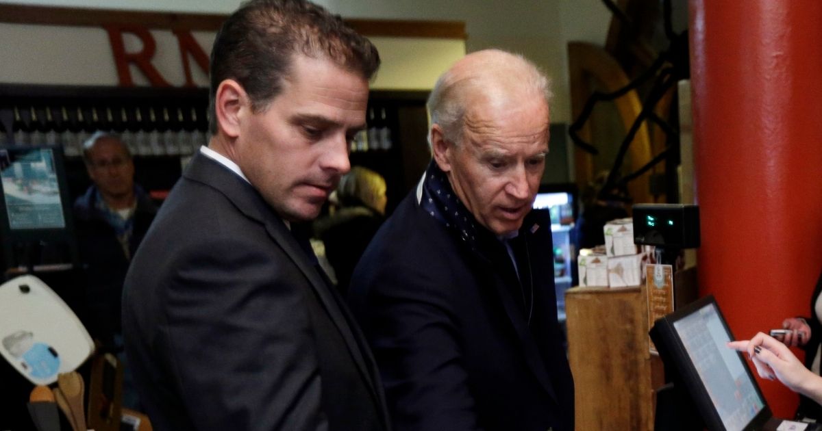 Then-Vice President Joe Biden, right, is accompanied by his son Hunter Biden during a visit to the Red Mug on Nov. 2, 2012, in Superior, Wisconsin.