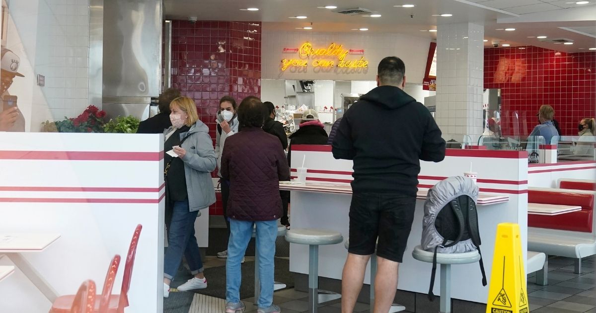 A group of customer wait inside the San Francisco In-N-Out near Fisherman's Wharf on Wednesday.