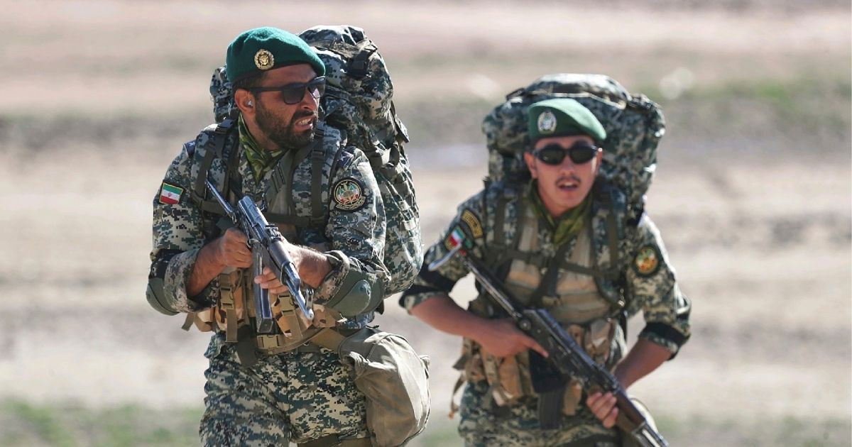 This undated picture released by the official website of the Iranian Army on Friday, Oct. 1, 2021, shows ground forces troops attending a maneuver near Iranian border with Azerbaijan.