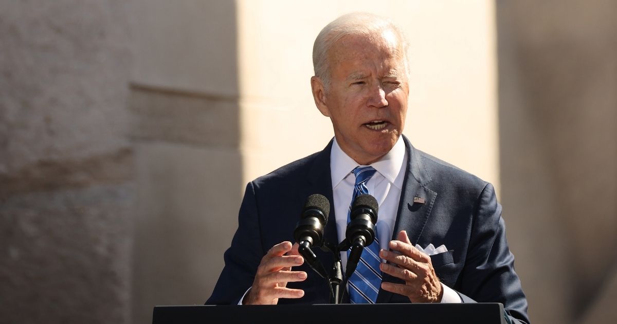 President Joe Biden delivers remarks near the Tidal Basin on the National Mall on Oct. 21 in Washington, D.C.