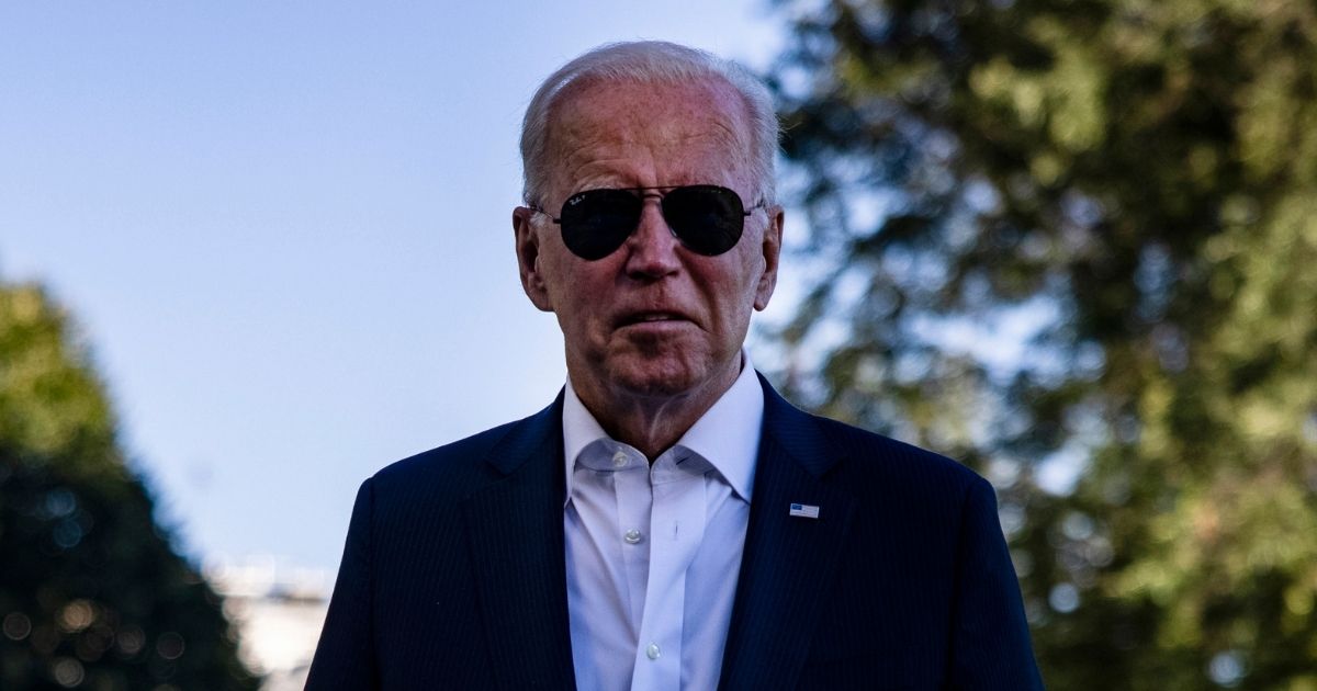 President Joe Biden walks over to gathered reporters at the White House after spending his weekend at Camp David on Sept. 26, 2021.