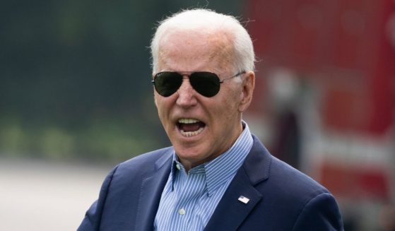 President Joe Biden reacts to shouted questions from reporters as he walks to Marine One on the South Lawn of the White House on July 21 in Washington, D.C.