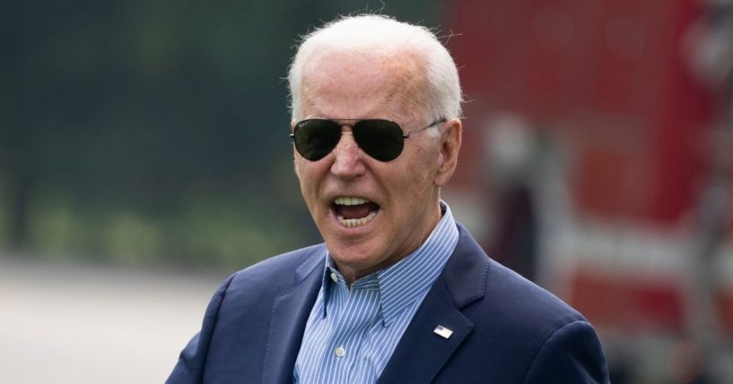 President Joe Biden reacts to shouted questions from reporters as he walks to Marine One on the South Lawn of the White House on July 21 in Washington, D.C.