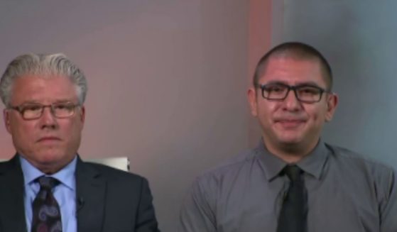 Denver police officer Jose Manriquez, right, and his attorney, Randy Corporon, make an appearance on "Fox & Friends" on Friday to discuss the vaccine mandate.