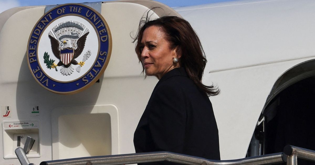 Vice President Kamala Harris looks back as she boards Air Force Two to return to Washington, D.C., from Joint Base Honolulu Pearl Harbor-Hickam, Hawaii on Aug. 26, 2021.