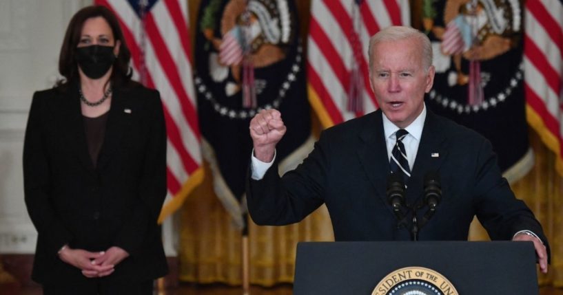 President Joe Biden speaks about his administration's social spending plans, as Vice President Kamala Harris look on, from the East Room of the White House in Washington, D.C., on Thursday.