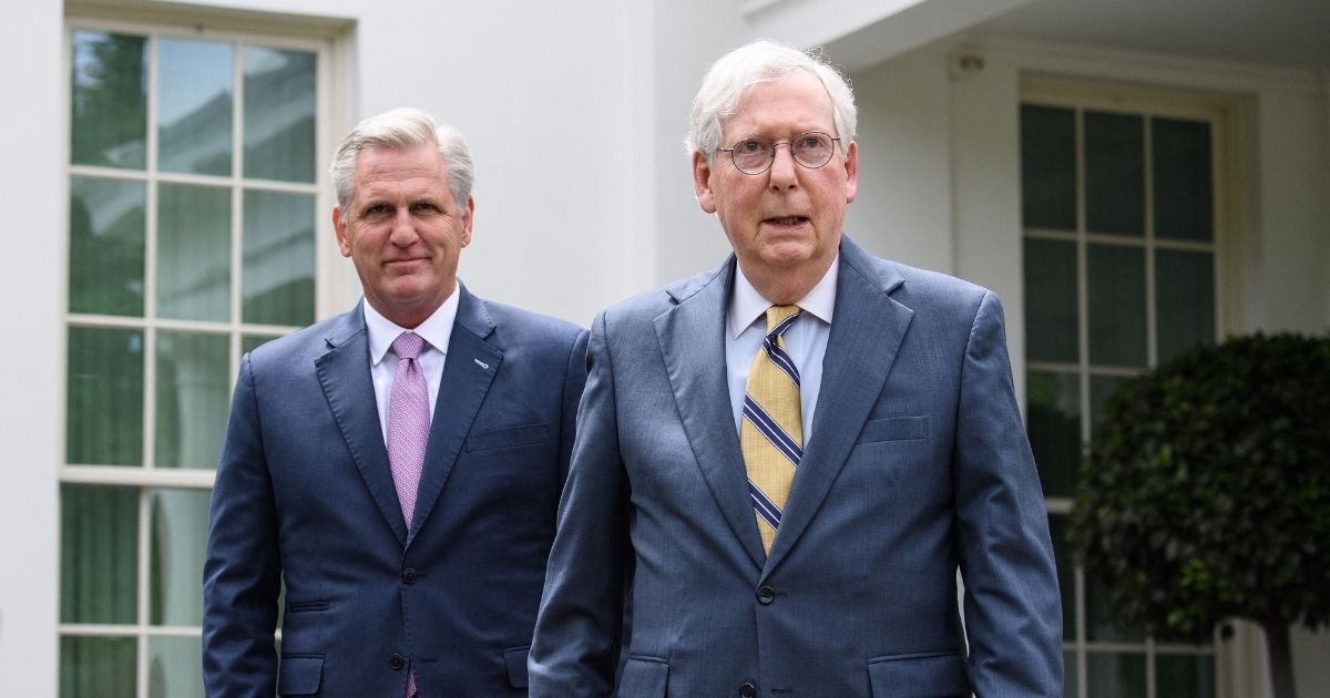 House Minority Leader Kevin McCarthy, left, and Senate Minority Leader Mitch McConnell arrive to speak to the media following their meeting with President Joe Biden and Democratic congressional leaders at the White House in Washington, D.C., on May 12, 2021.