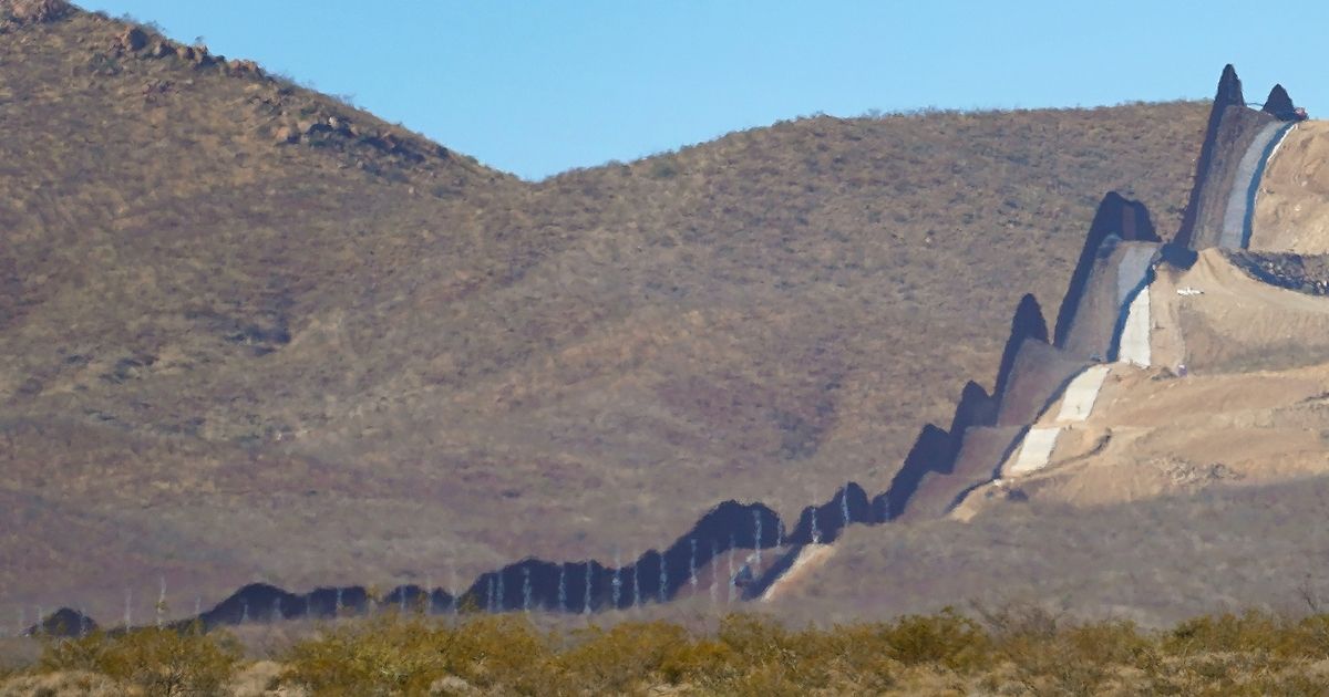 The rugged desert landscape of northern Mexico (left) is shown near the United Stated border wall near Douglas, Arizona.