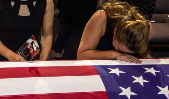 People pay their respects during the funeral of Marine Lance Cpt. Kareem Grant Nikoui at the Harvest Christian Fellowship in Riverside, California, on Sept. 18.