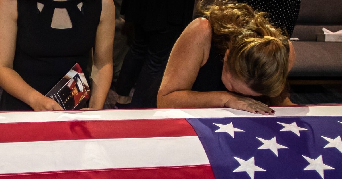 People pay their respects during the funeral of Marine Lance Cpt. Kareem Grant Nikoui at the Harvest Christian Fellowship in Riverside, California, on Sept. 18.
