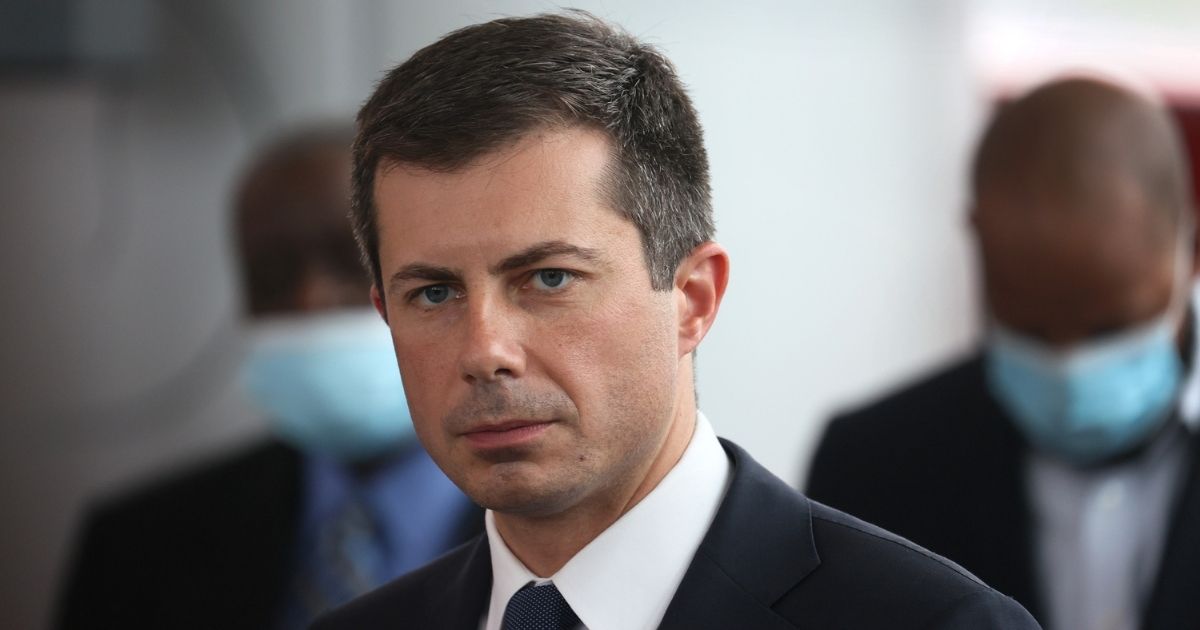 Transportation Secretary Pete Buttigieg listens to a question during a news conference following a tour of a Southside transportation hub on July 16 in Chicago.