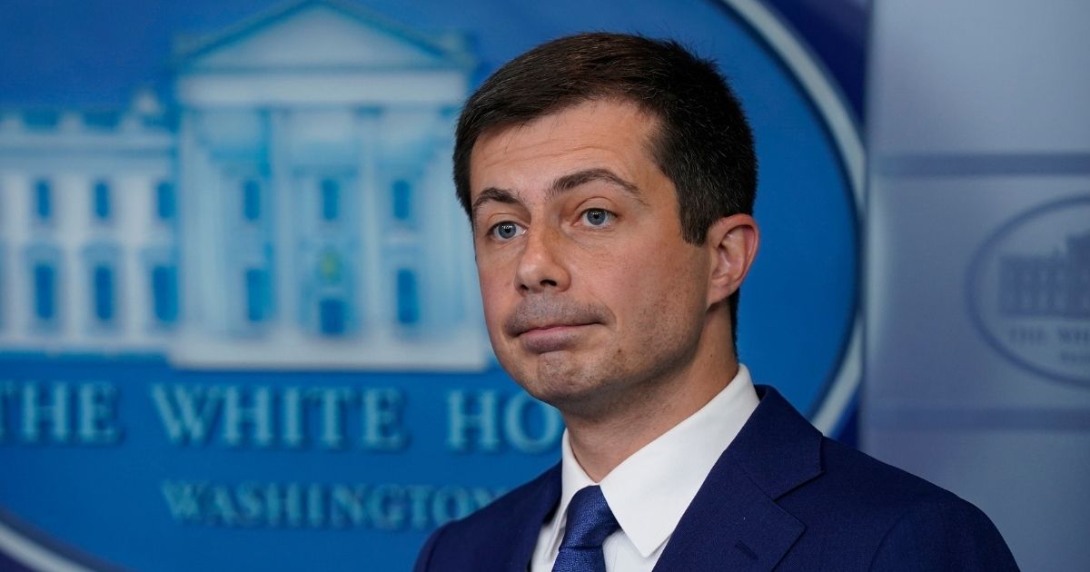 Secretary of Transportation Security Pete Buttigieg attends a news conference at the White House on May 12.