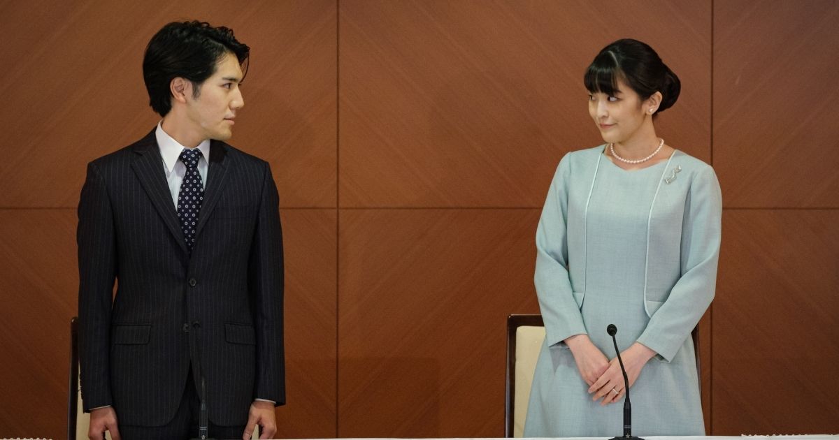 Mako Komuro, elder daughter of Prince Akishino and Princess Kiko of Japan, and her husband Kei Komuro pose during a news conference on Tuesday in Tokyo.