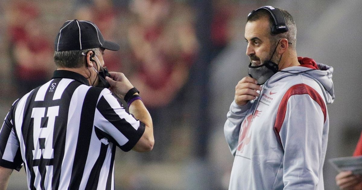 Then-Washington State head football coach Nick Rolovich, speaks with an official during a Sept. 4 game against Utah State in Pullman.