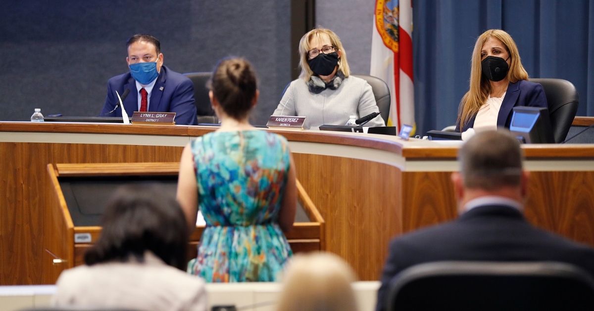 Schools board members looks on while members of the public speak during the special board meeting at the Hillsborough County Public Schools district office on Aug. 6, 2020, in Tampa, Florida.
