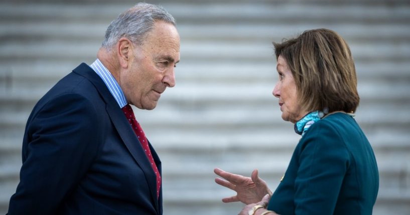 Democratic Senate Majority Leader Chuck Schumer, left, talks with Speaker of the House Nancy Pelosi on the steps of the U.S. Capitol on June 14, 2021.