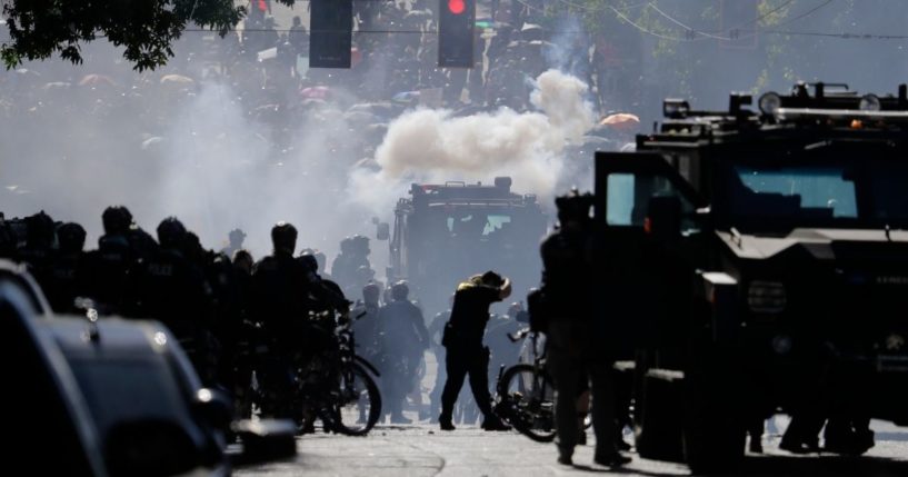 Police clashes with protesters, such as the one shown in this photo from July 25, 2020, have led many Seattle law enforcement officers to resign. Now the Seattle Police Department stands to lose hundreds more officers due to the COVID vaccine mandate.