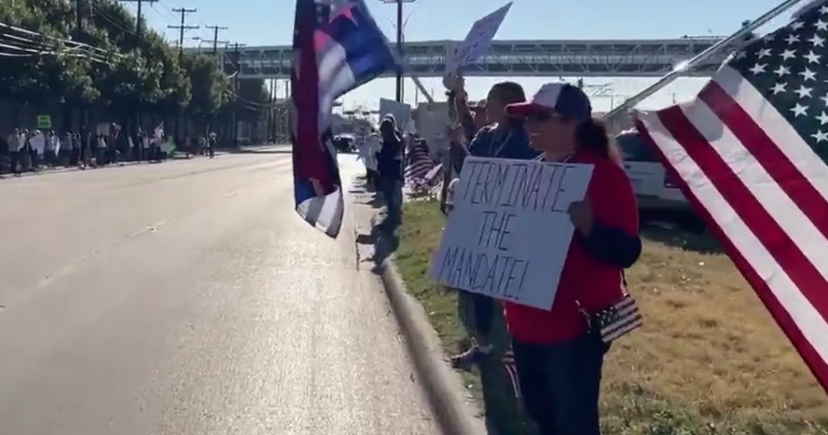 Current and former Southwest Airlines employees gather outside the company's Dallas headquarters on Monday to protest the company's vaccine mandate.