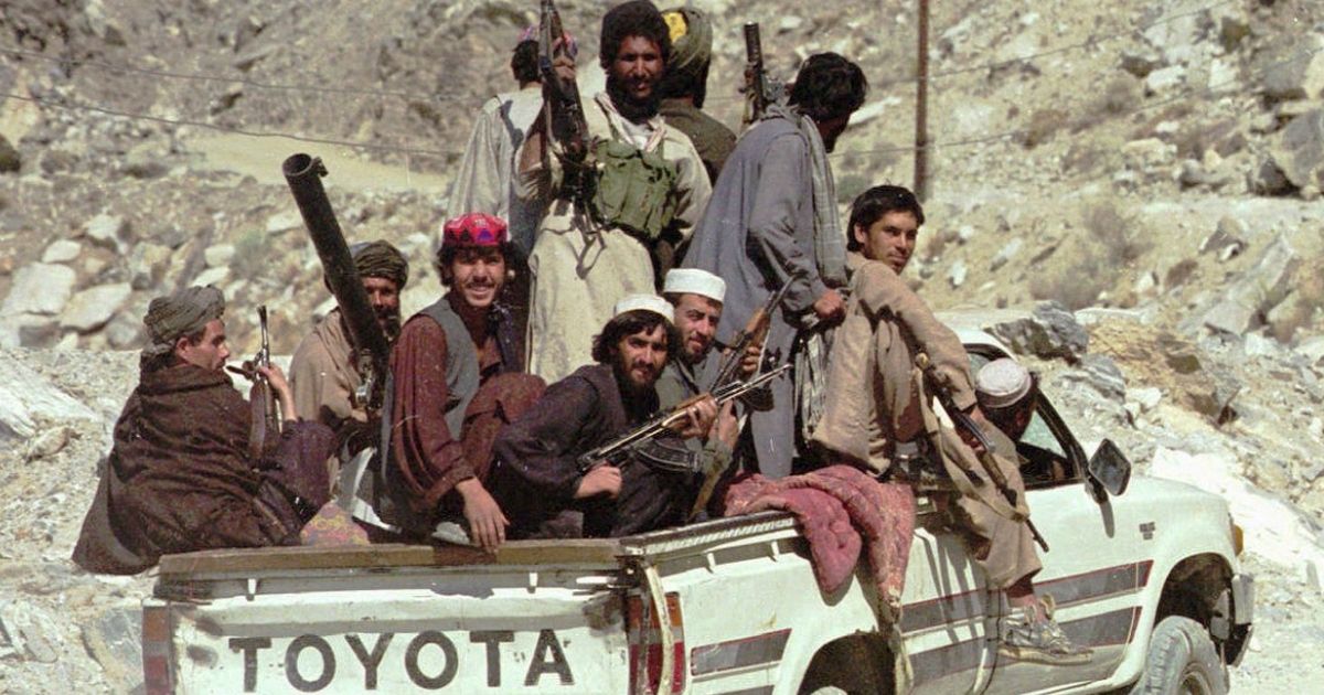 Taliban soldiers drive in a pickup truck to Surobi, Afghanistan on Oct. 16, 1996.