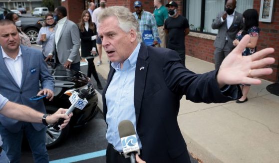 Democratic gubernatorial candidate and former Virginia Gov. Terry McAuliffe answers questions from reporters after speaking during a campaign event at The Happy Cafe on Monday in Virginia Beach, Virginia.