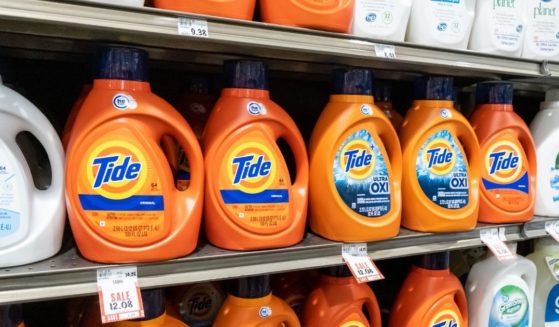 Containers of Tide detergent are seen on a grocery store shelf.