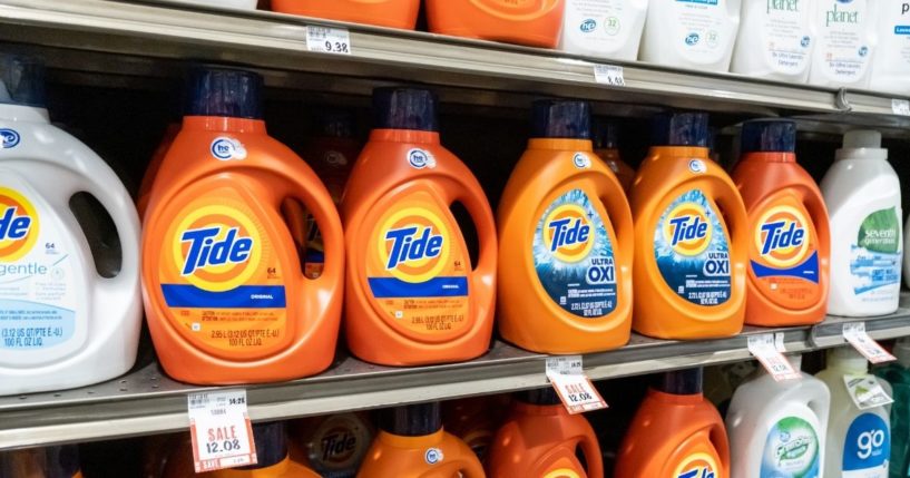 Containers of Tide detergent are seen on a grocery store shelf.