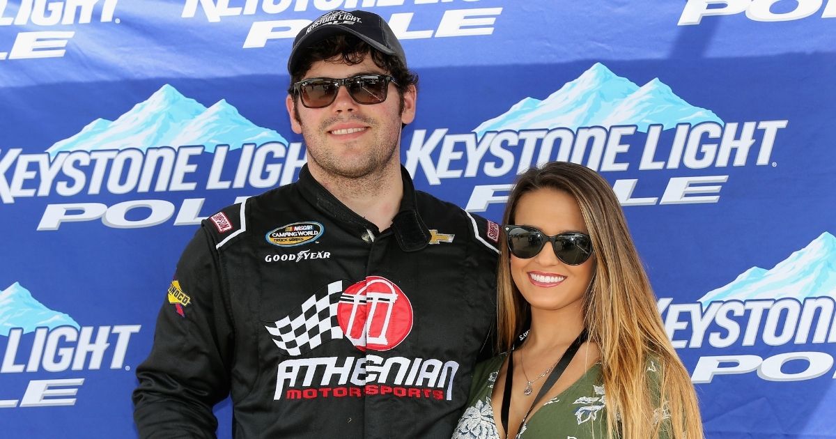 John Wes Townley and then-girlfriend Laura Bird pose with the Keystone Light Pole Award after qualifying for the NASCAR Camping World Truck Series Careers for Veterans 200 at Michigan International Speedway in Brooklyn, Michigan, on Aug. 27, 2016.