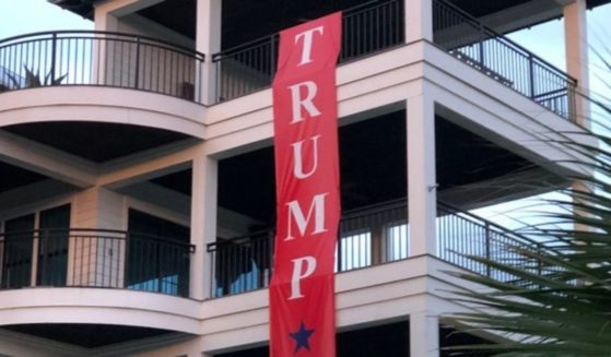 A massive "Trump won" banner hangs over the home of Martin Peavy in Seagrove, Florida.