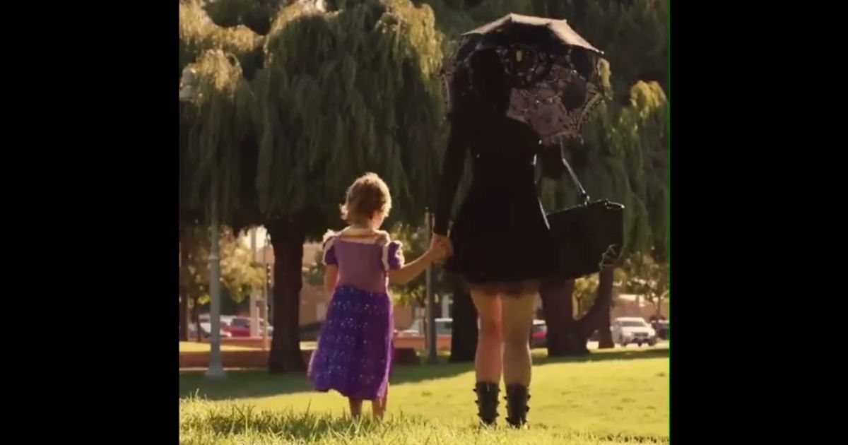 An ad released by Mars, Inc. for its Twix candy bar shows a young boy wearing a dress accompanied by a woman dressed in all black as a "witch."