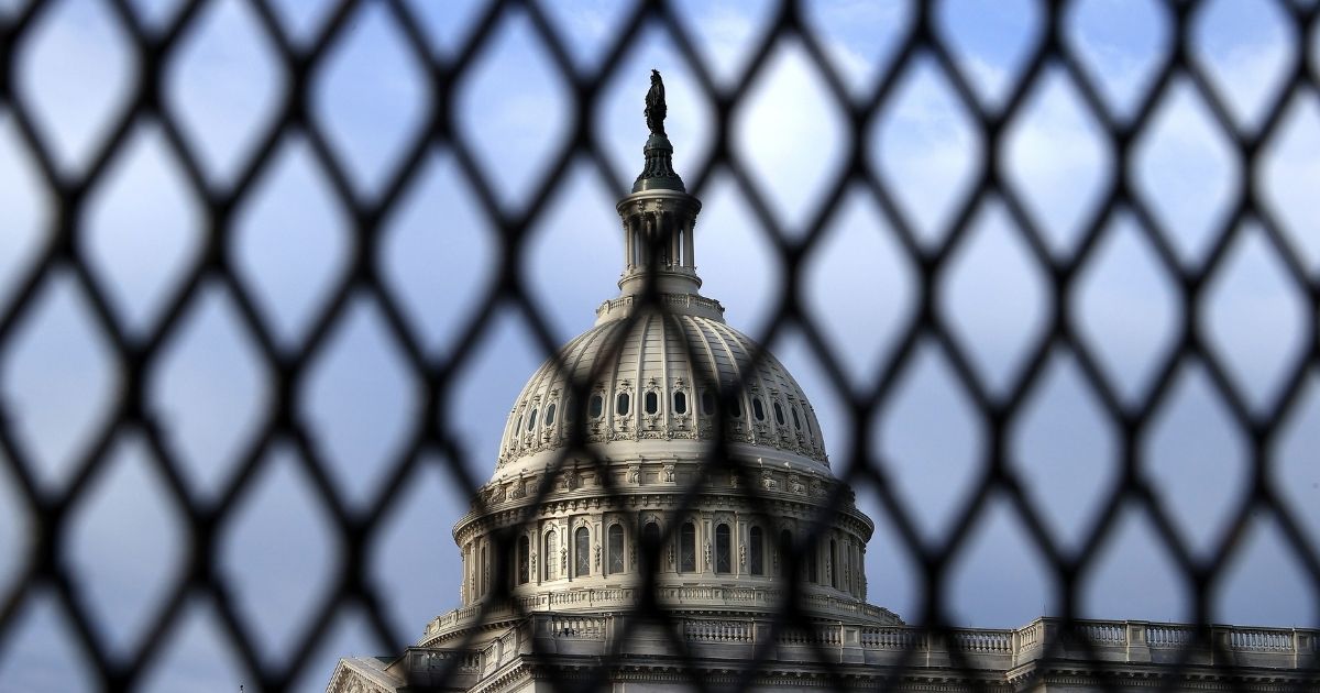The U.S. Capitol Dome is seen through security fencing on May 12, 2021, in Washington, D.C.