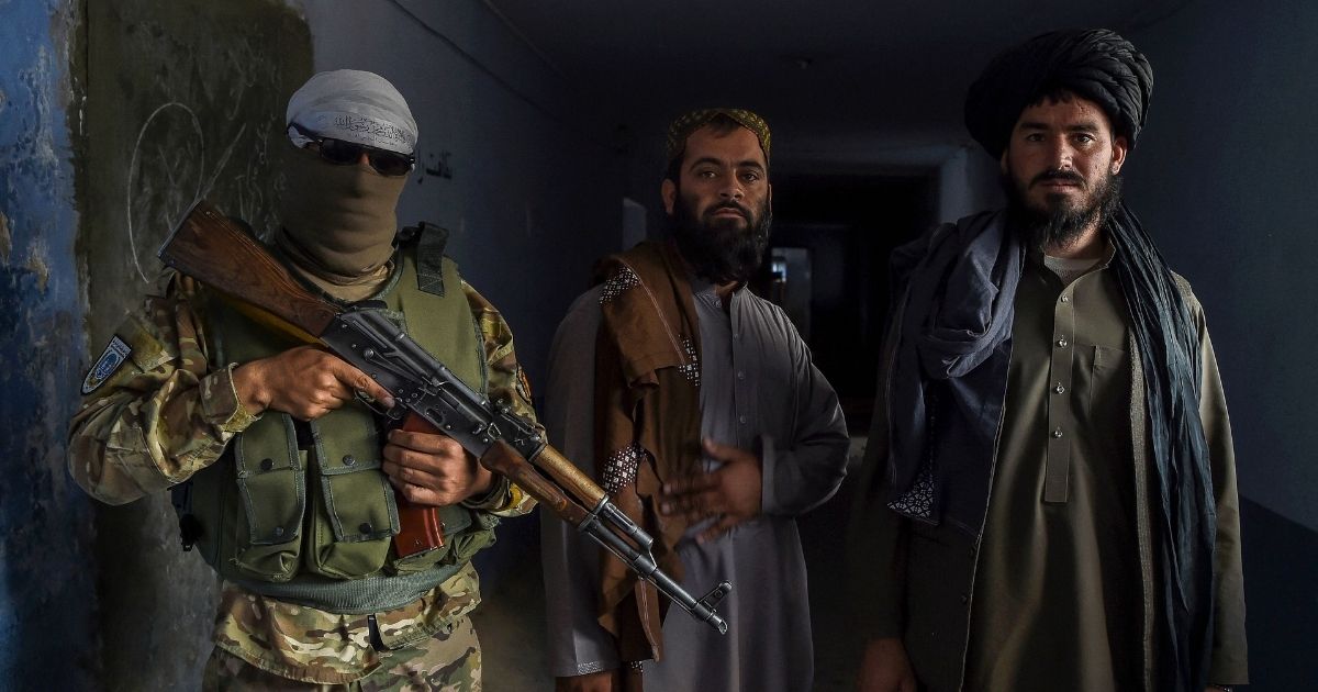 Taliban members guard a cell at Pul-e-Charkhi prison in the outskirts of Kabul, Afghanistan, on Sunday.