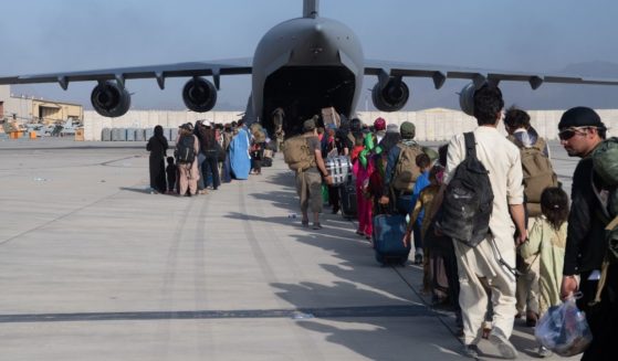 U.S. Air Force loadmasters and pilots assigned to the 816th Expeditionary Airlift Squadron, load passengers aboard a U.S. Air Force C-17 Globemaster III in support of the Afghanistan evacuation at Hamid Karzai International Airport on Aug. 24, in Kabul, Afghanistan.