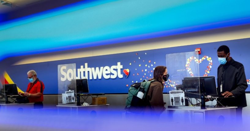 A traveler checks in at the Southwest Airlines ticketing counter at Baltimore Washington International Thurgood Marshall Airport on Oct. 11, in Baltimore, Maryland.