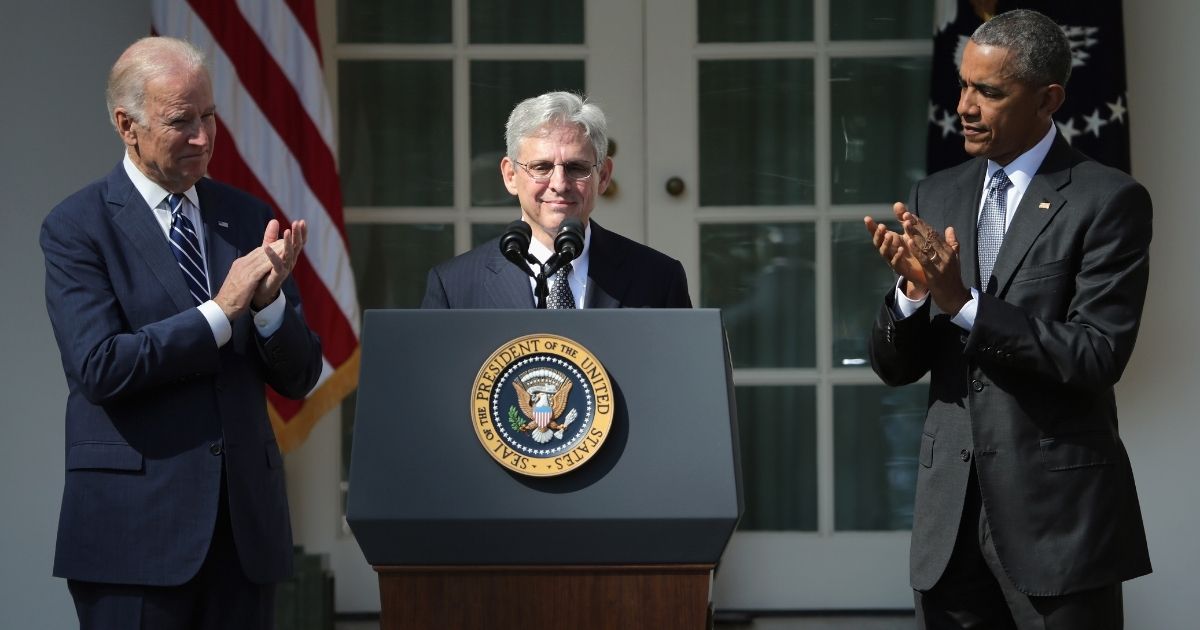 Then-President Barack Obama and then-Vice President Joe Biden stands with then-Judge Merrick B. Garland while nominating him to the U.S. Supreme Court, in the Rose Garden at the White House, March 16, 2016, in Washington, D.C.