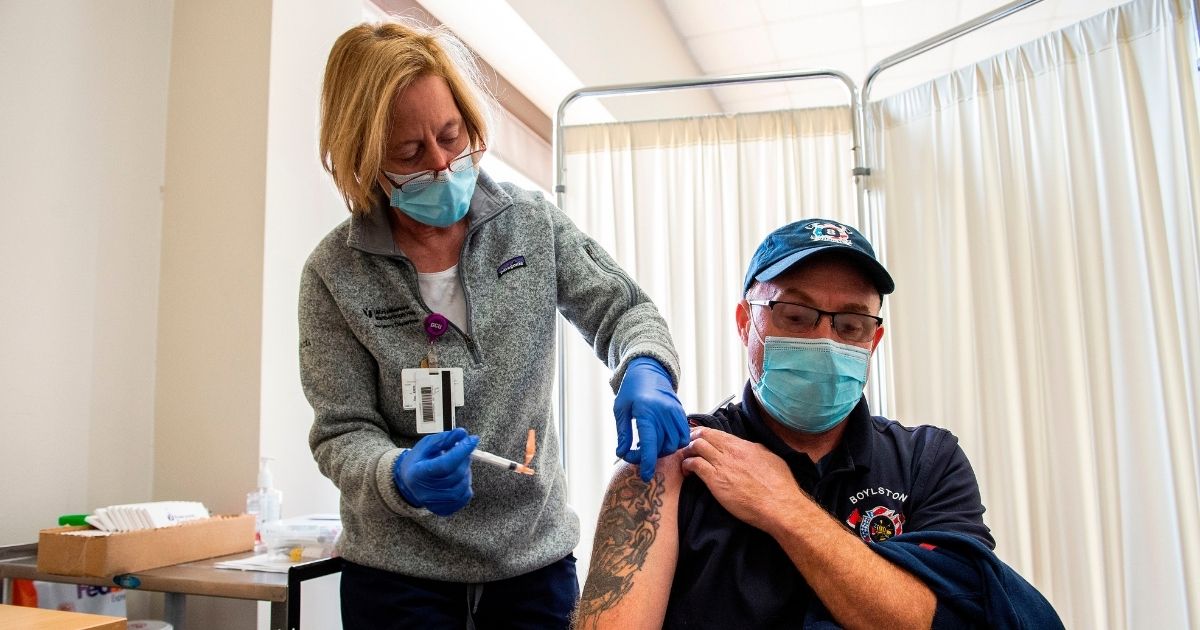 A nurse administers the COVID-19 vaccine at UMass Memorial Hospital in Marlborough, Massachusetts, on Jan. 12.