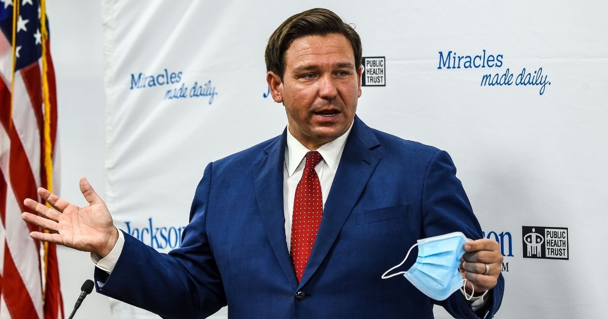 Florida Gov. Ron DeSantis speaks holding his facemask during a press conference to address the rise of coronavirus cases in the state, at Jackson Memorial Hospital in Miami, on July 13, 2020.