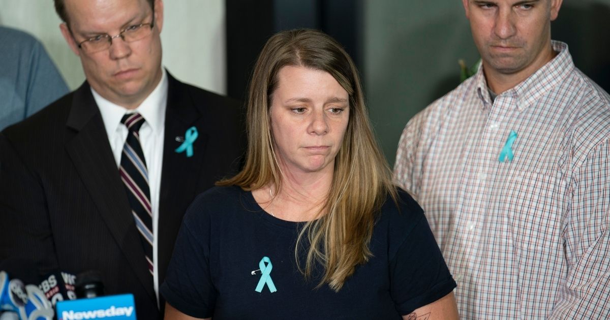 Nichole Schmidt, mother of Gabby Petito, whose death on a cross-country trip has sparked a manhunt for her boyfriend, Brian Laundrie, pauses as she answer reporters' questions during a news conference on Sept. 28, 2021.