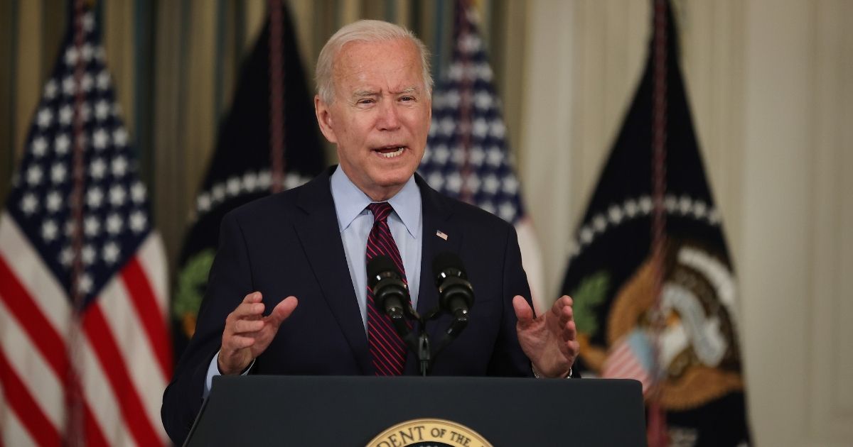 President Joe Biden speaks to the media Monday in the State Room of the White House about raising the nation's debt ceiling.