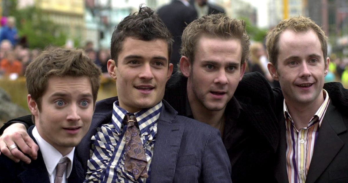 Actors from 'The Lord of the Rings' trilogy -- from left, Elijah Wood, Orlando Bloom, Dominic Monaghan and Billy Boyd, all of whom play Hobbits -- pose to the media as they walk down the red carpet for a premiere at the Embassy Theatre in Wellington, New Zealand, on Dec. 19, 2001.