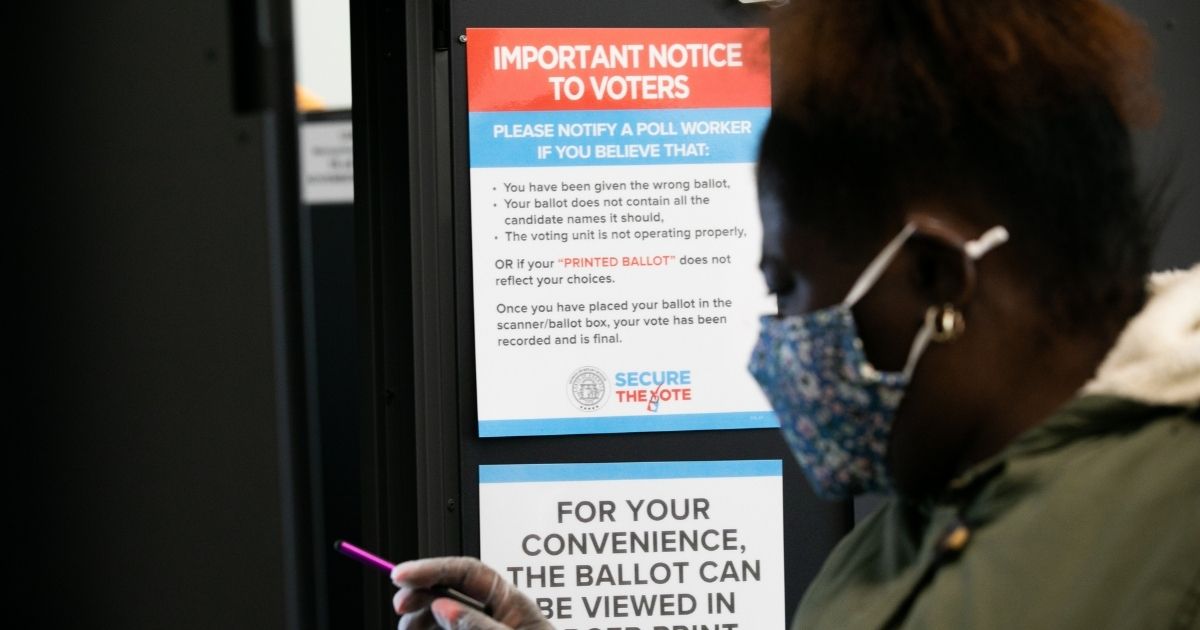 A voter casts a ballot at the Metropolitan Library in Atlanta, Georgia, on Nov. 3, 2020.