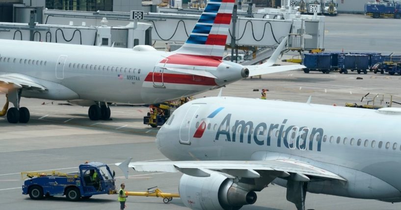American Airlines passenger jets prepare for departure near a terminal at Boston Logan International Airport in Boston on July 21.