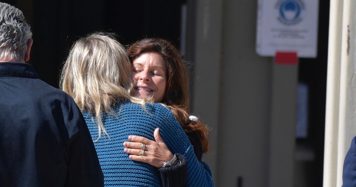 Marianne Campbell Smith hugs a supporter as she leaves the West Justice Center in Westminster, California, on Wednesday.