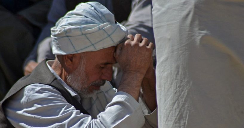 A man mourns at a graveyard in Kandahar, Afghanistan, on Oct. 16.