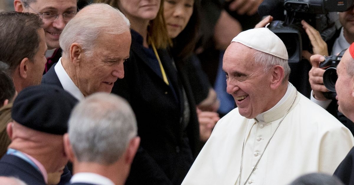 Pope Francis shakes hands with then-Vice President Joe Biden at the Pope Paul VI hall at the Vatican on April 29, 2016.