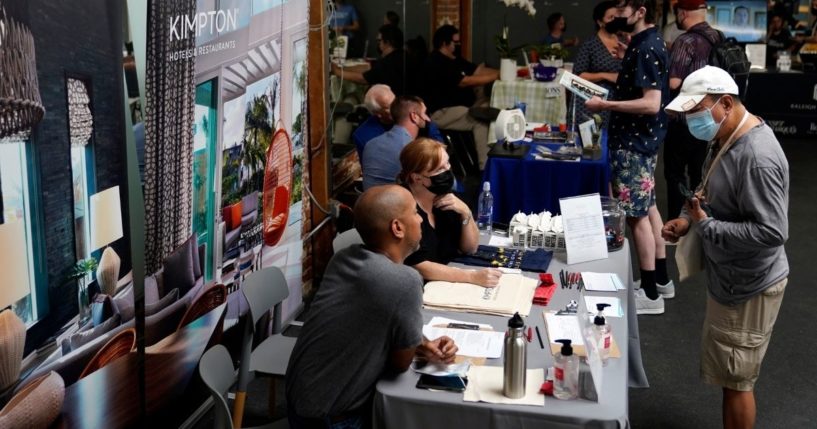 Prospective employers and job seekers interact during a job fair in the West Hollywood section of Los Angeles on Sept. 22.